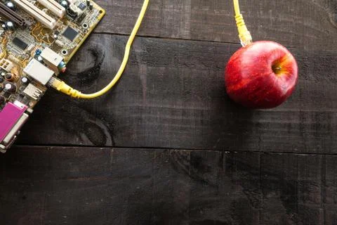 Green apple connected to a data network Stock Photos