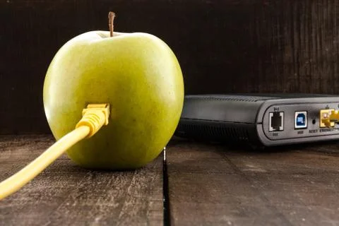 Green apple connected to a data network Stock Photos
