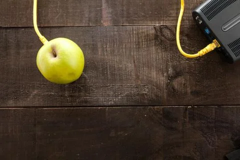 Green apple connected to a data network Stock Photos