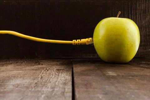 Green apple connected to a data network Stock Photos
