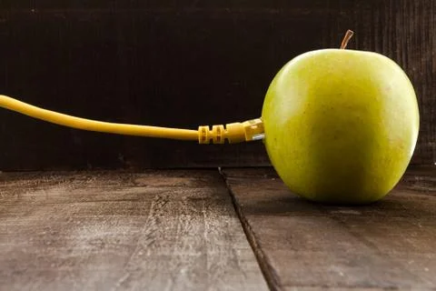 Green apple connected to a data network Stock Photos