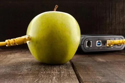 Green apple connected to a data network Stock Photos