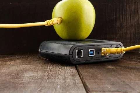 Green apple connected to a data network Stock Photos