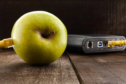 Green apple connected to a data network Stock Photos