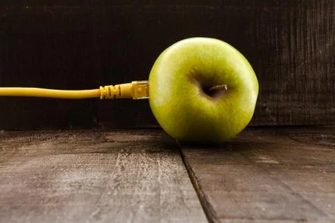 Green apple connected to a data network Stock Photos
