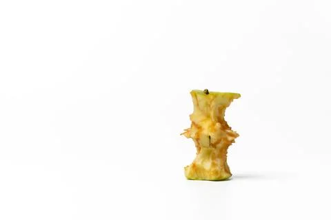 Green apple core on a white background Stock Photos