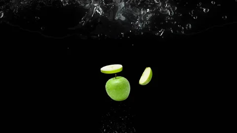 Green apple fall in water Stock Footage 141122633