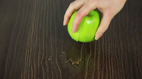 Green apple falls into slices Stock Footage 61439593