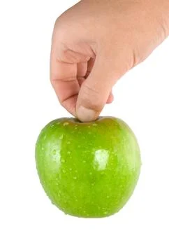 Green apple in hand (path) Stock Photos