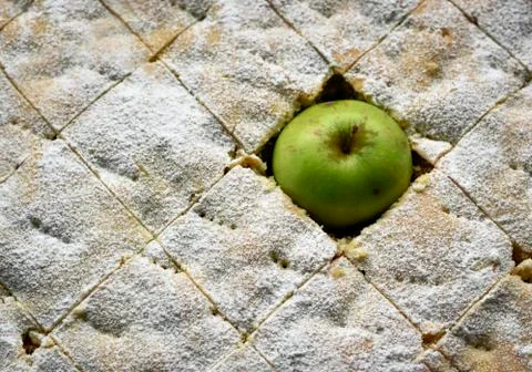 Green apple hidden in a cake Stock Photos