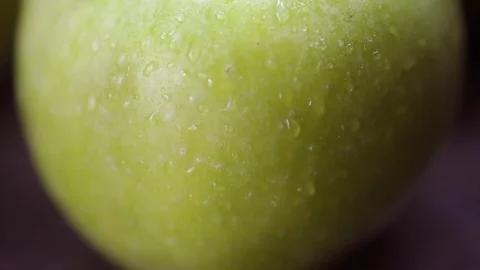 Green apple in the kitchen on a table Stock Footage