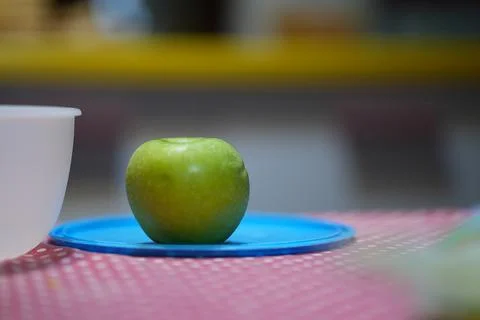 Green Apple on the kitchen table Stock Photos