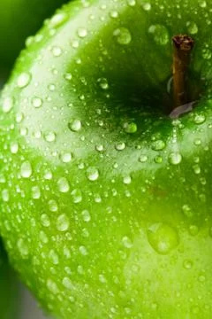 Green apple macro in selective focus Stock Photos