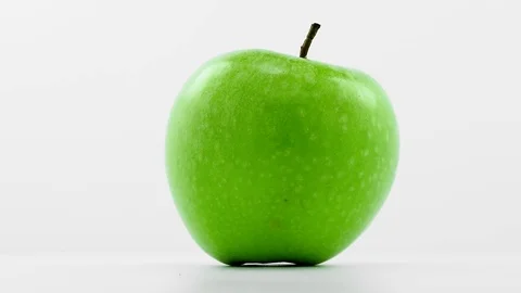 Green  apple   rotates in loop  Stock Footage 69975299