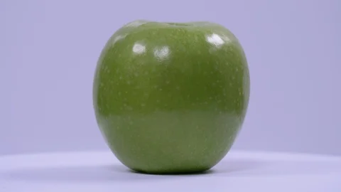 Green Apple Rotating on White Background. Fresh, Healthy, Stock Footage 128330053