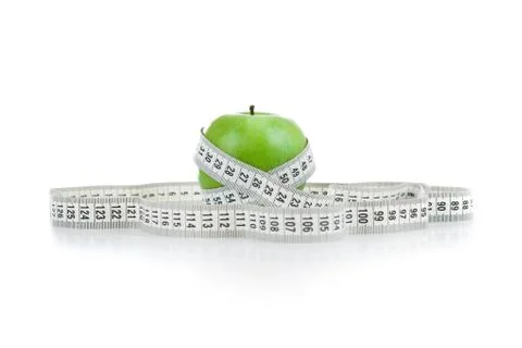 Green apple with a ruler Foto stock
