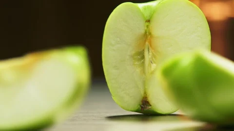 Green apple sliced in three Stock Footage 121183707