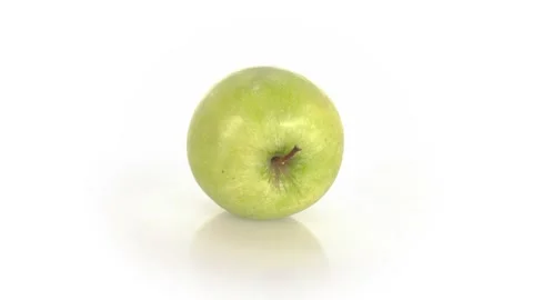 Green Apple spinning isolated on white background Stock Footage 222467606