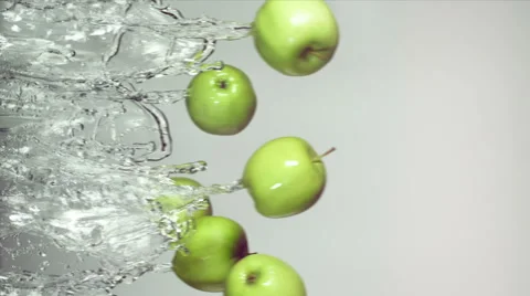 Green apple with splashes of water Stock Footage 61249741