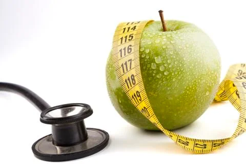 Green apple with stethoscope Stock Photos