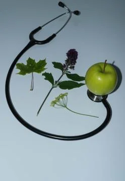 Green apple, stethoscope Stock Photos