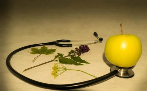 Green apple, stethoscope Stock Photos