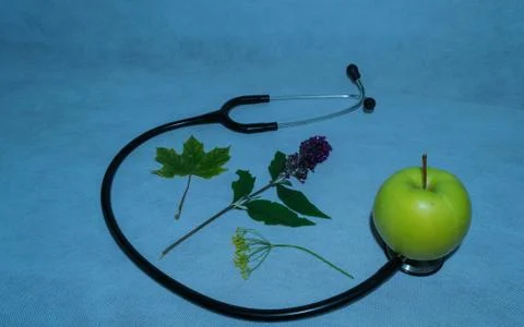 Green apple, stethoscope Stock Photos