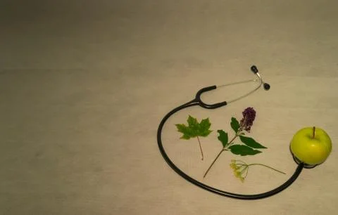 Green apple, stethoscope Stock Photos