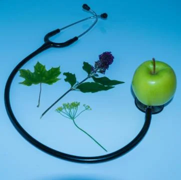 Green apple, stethoscope Stock Photos