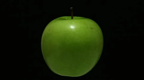 Green apple turning in dark Stock Footage 67720581