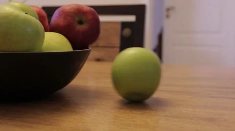 Green apple turns spinning on a table Stock Footage 48812553