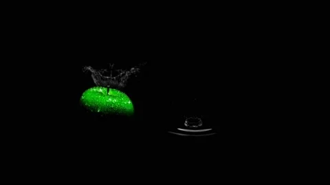 Green Apple on water during Raining time with Slow motion of water drops. Stock Footage 142390609