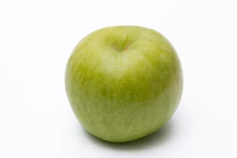 Green apple with white background close up Stock Photos