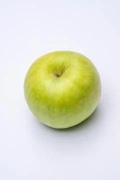 Green apple with white background close up Stock Photos