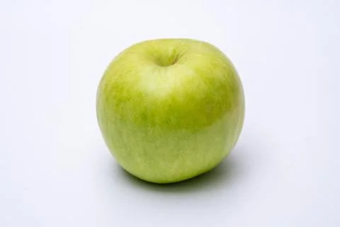 Green apple with white background close up Stock Photos