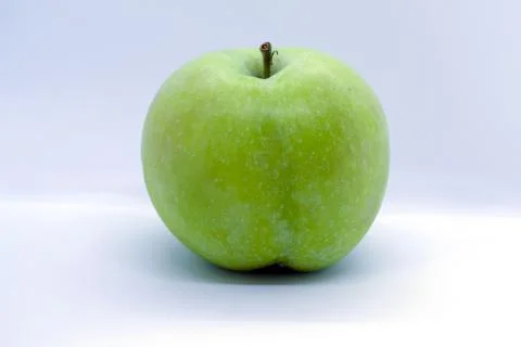 Green apple on a white background Stock Photos