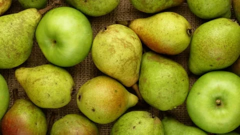 Green apples and pears on a sacking. Ripe fruits. Stock Footage 140040608