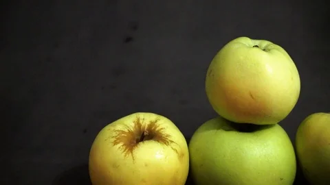 Green apples on a black background. fruit on black background. scattered apples. Stock Footage 99400951