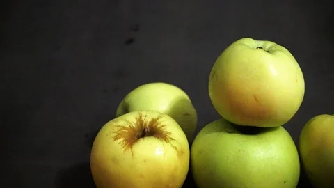 Green apples on a black background. fruit on black background. Stock Footage 99400963