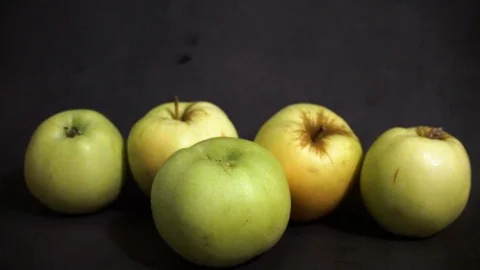 Green apples on a black background. fruit on black background. Stock Footage 99400970