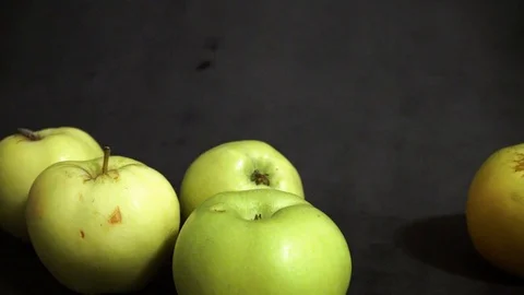 Green apples on a black background. fruit on black background. Stock Footage 99400977