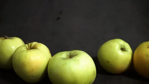 Green apples on a black background. fruit on black background. Stock Footage 99400978
