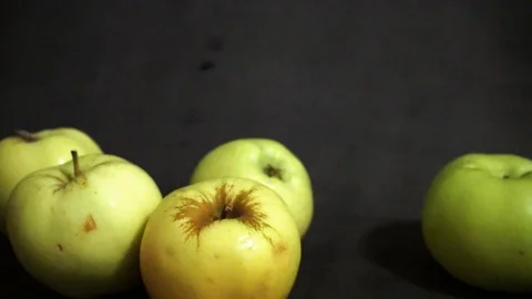 Green apples on a black background. fruit on black background. Stock Footage 99400983