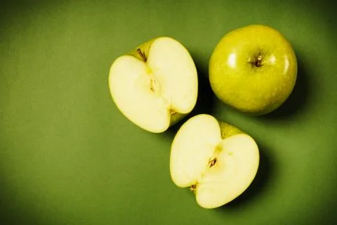 Green apples on a colored background Stock Photos