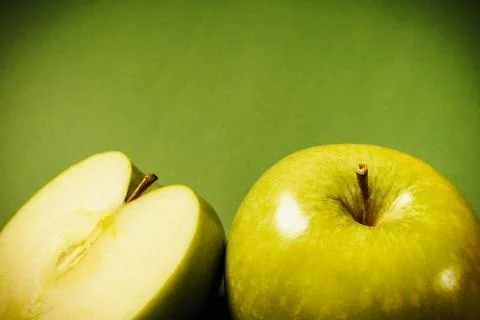 Green apples on a colored background Stock Photos