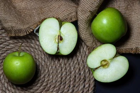 Green apples on a dark background. Fruit theme Stock Photos