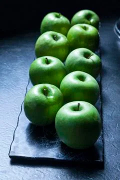 Green apples on the dark backround Stock Photos