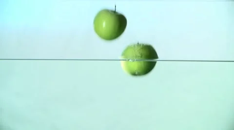 Green Apples Fall in Water Slow Motion Video stock 59307532