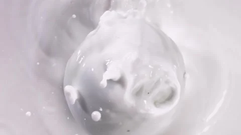 Green apples falling into milk，slow motion Video stock 248406783