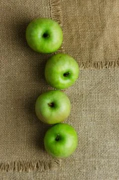 Green apples in a row Stock Photos